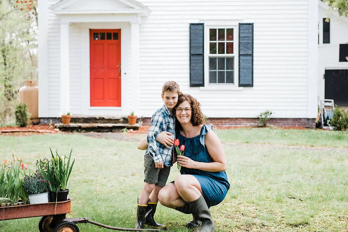 A family in front of their home