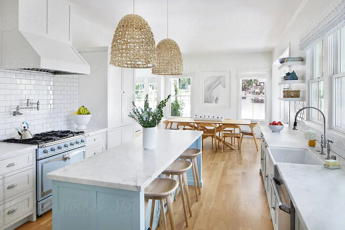 A bright, staged living room with a dining area